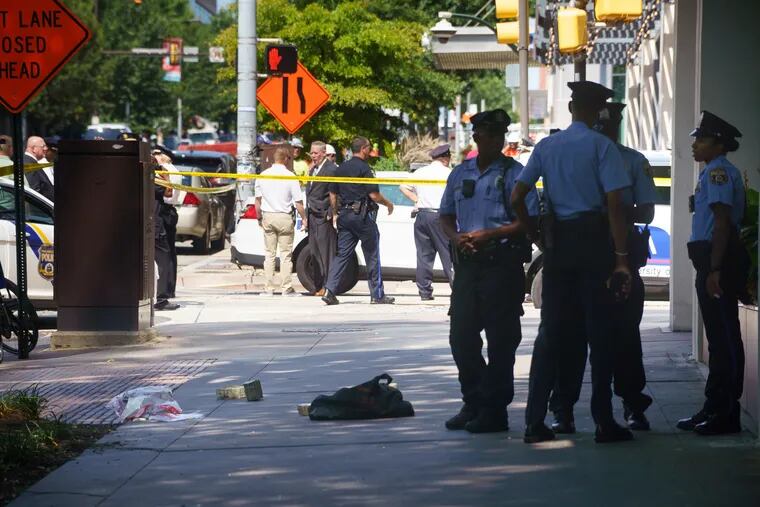 Police investigate at the scene of an armored truck robbery at 36th and Market, in Philadelphia, August 1, 2019.