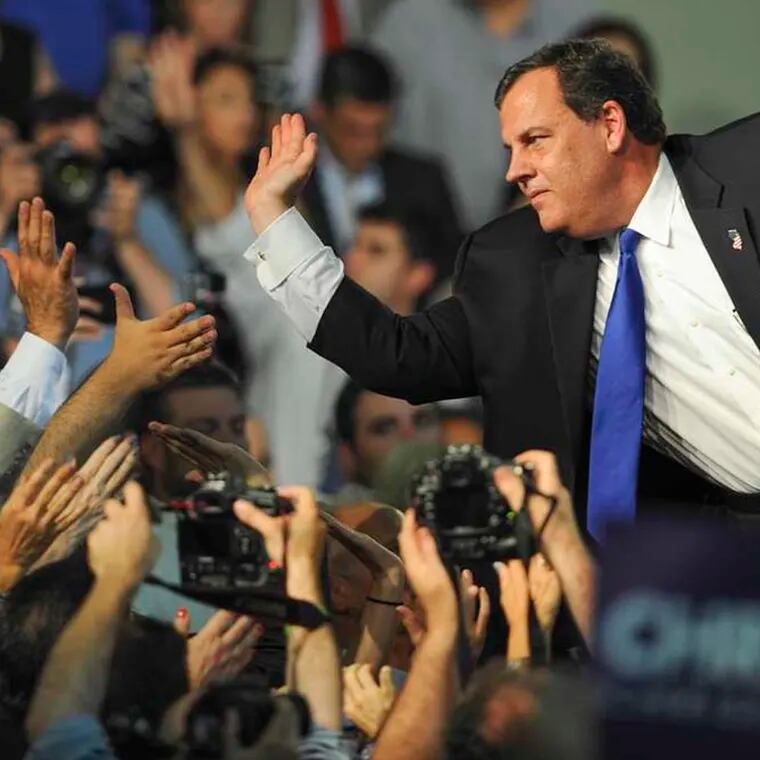 New Jersey Gov. Chris Christie slaps high-fives with supporters in the Livingston High School gym after announcing his candidacy for the GOP nomination for President in 2015. Christie is an alumnus of the high school.
