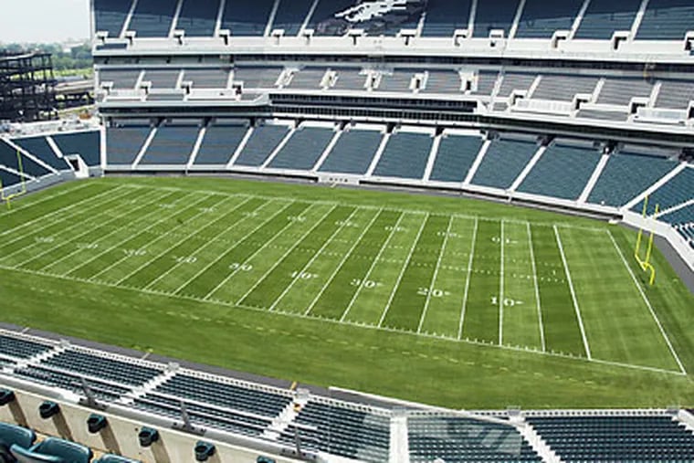 The Eagles are considering building field-level boxes, additional seats and a new video board at the Linc. (H. Rumph Jr/AP file photo)