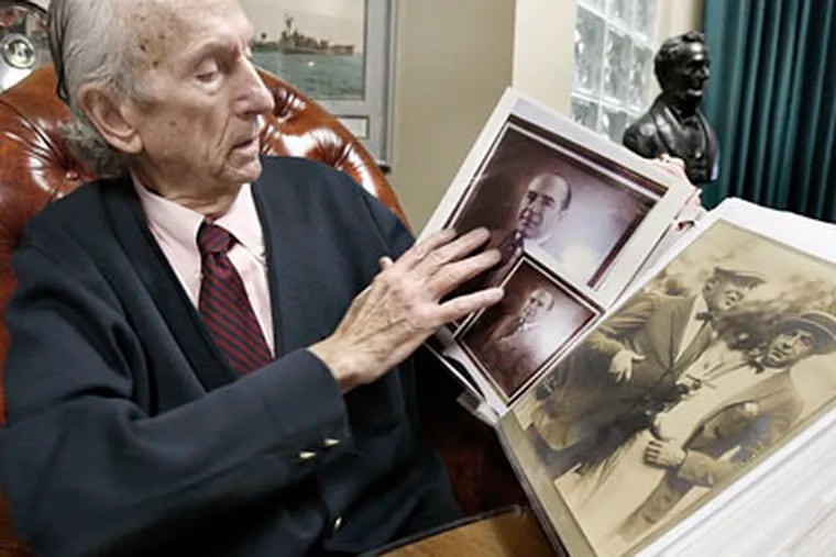 Ventnor attorney Frank J. Ferry displays an album of photos and notes scribbled by Nucky Johnson, an acquaintance of his. ("Boardwalk Empire" gives Nucky the last name Thompson.)