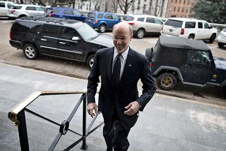 Gov. Tom Wolf arrives for his first day of work at the Capitol building on Wednesday, Jan. 21, 2015, in Harrisburg. (AP Photo/PennLive.com, Sean Simmers)