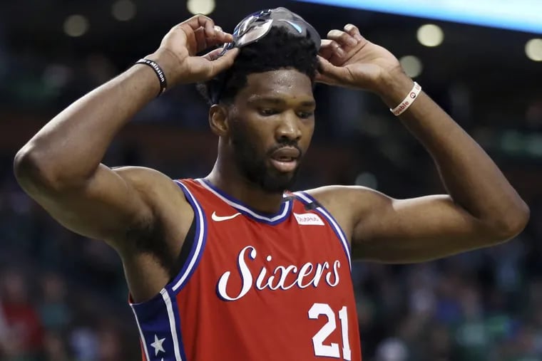 Joel Embiid ,lifting his mask during a break in the fourth quarter Monday, wasn’t fazed by the Celtics crowd.