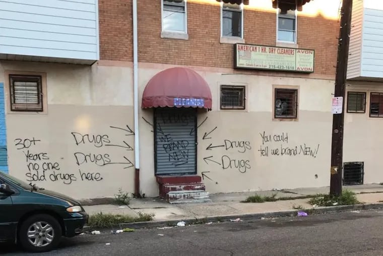 Graffiti loudly announcing the location of drug dealers popped up overnight on the 2200 block of Hancock Street Sunday after the pushers moved into the block to try and sell their wares.