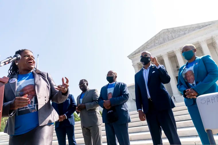 Transformative Justice Coalition president and founder Barbara Arnwine, with the brothers of the late Rep. John Lewis (D., Ga.), Henry Lewis and Samuel Lewis, Democratic Texas State Rep. Ron Reynolds from Missouri City, and the niece of Lewis, Angela Lewis Warren, speaks during a voting rights rally on the steps of the Supreme Court in Washington, Wednesday, Aug. 11, 2021. Congress has not yet passed the For the People Act and the John R. Lewis Voting Rights Act.