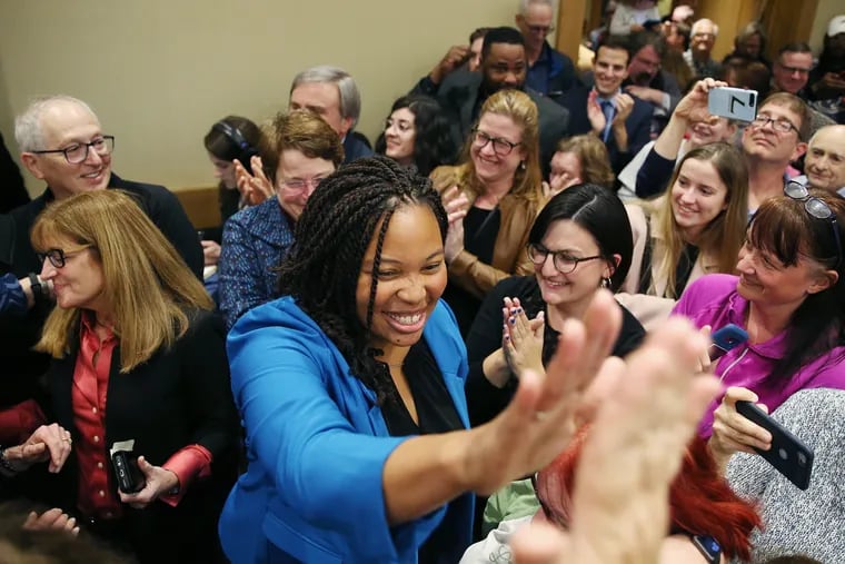 Delaware County Council candidate Monica Taylor high-fives a supporter during the Delaware County Democratic Committee's election watch party at the Inn at Swarthmore in Swarthmore Pa., on Tuesday, Nov. 5, 2019.