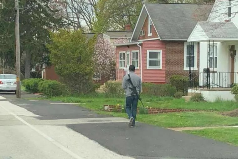 A man was recently seen walking through Abington with an AR-15 rifle. Police say they believe a resident took this photo, which was posted on Facebook.