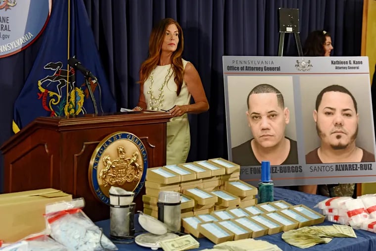 Attorney General Kathleen Kane prepares to announce the arrest of two men on drug charges and the seizure of 250 grams of heroin, along with drug processing paraphernalia. Arrested were Felipe Fontanez-Burgos (left photo) and Santos Javier Alvarez-Ruiz, both from Northeast Philadelphia.