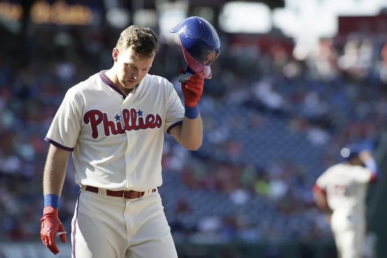 Rhys Hoskins walks away from the plate after getting called out on strikes in the seventh inning of the Phillies' loss on Sunday.