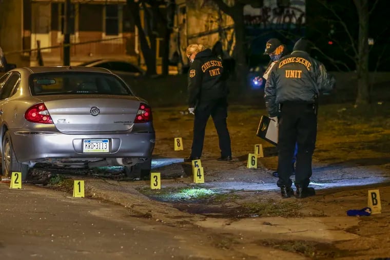 Crime scene police gather evidence in the 1800 block of N.18th street in the 22nd police district where a man in his 50's was fatally shot multiple times, Tuesday, January 5, 2021.