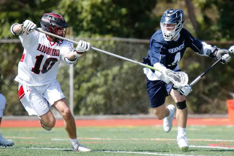 St. Augustine attacker Mike Vanaman (4) is marked by Haddonfield defender Ben Nugent during the fourth quarter of a nonleague lacrosse game Saturday, April 6, 2019, at Haddonfield. St. Augustine went on to win, 10-3. LOU RABITO / Staff
