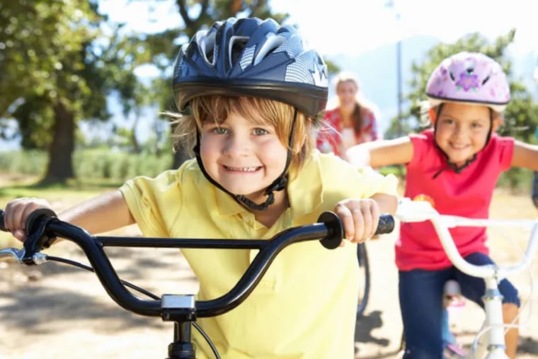 Children riding their bikes.