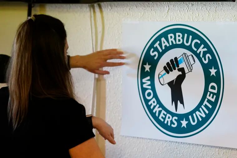 Michelle Eisen, a barista at a Buffalo, N.Y., Starbucks location, helping out the local Starbucks Workers United, employees of a local Starbucks, as they gather at a local union hall to cast votes to unionize or not, on Feb. 16 in Mesa, Ariz.