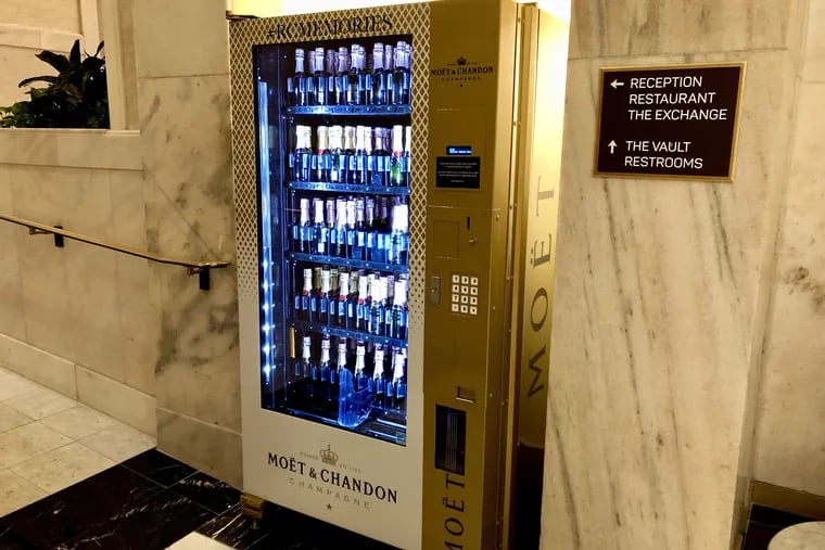 The Moet Mini-matic champagne vending machine is set up in the lobby of the Ritz-Carlton Hotel.