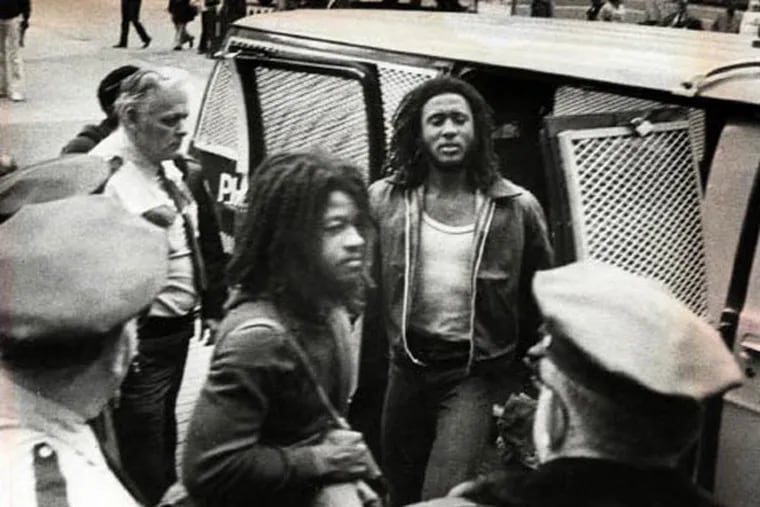 Delbert Africa (center) glares at deputies as he and Chuck Sims Africa leave court at City Hall during their 1979 trial for the murder of Officer James Ramp. Chuck Sims Africa was released from prison Friday.