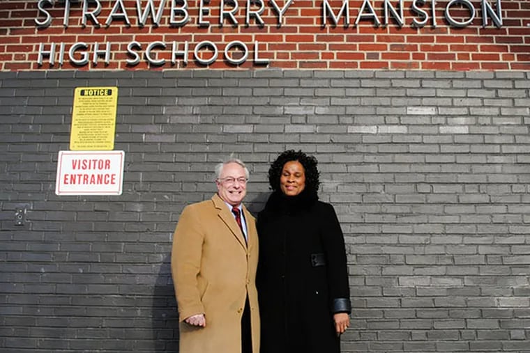 Principal Linda Wayman and federal prosecutor Rob Reed stand in front of Strawberry Mansion High School. (Gabriela Barrantes / DAILY NEWS STAFF)