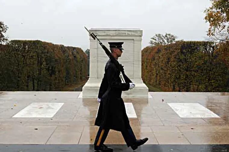 This handout photo provided by the us Army shows Spc. Brett Hyde, Tomb Sentinel, 3d U.S. Infantry Regiment (The Old Guard), keeping guard over the Tomb of the Unknown Soldier during Hurricane Sandy, at Arlington National Cemetery, Va., Monday, Oct. 29, 2012. Just like the Sentinel's Creed says "Through the years of diligence and praise and the discomfort of the elements, I will walk my tour in humble reverence to the best of my ability."    (AP Photo/Sgt. Jose A. Torres Jr.,/U.S. Army Photo)