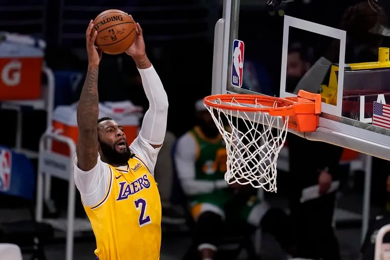 Los Angeles Lakers center Andre Drummond (2) goes up for a shot against the Utah Jazz during the first half of an NBA basketball game Monday, April 19, 2021, in Los Angeles.