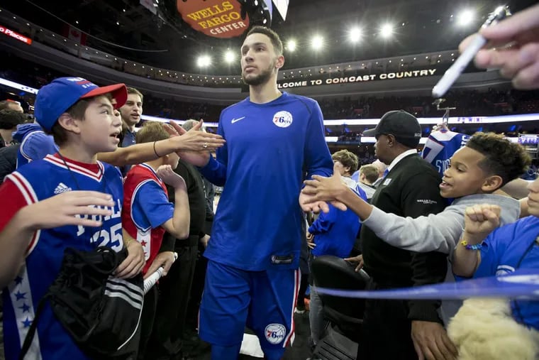Ben Simmons of the Sixers makes his way through the crowd after their 101-81 victory over the Trailblazers at the Wells Fargo Center on Nov. 22, 2017.