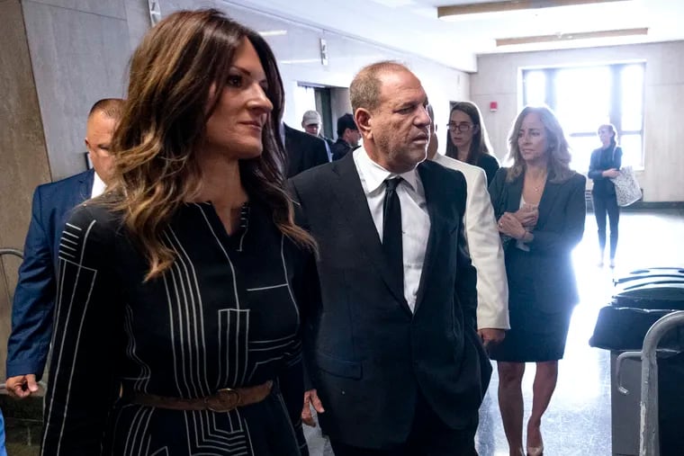 Harvey Weinstein, center, appears in a courthouse for a scheduled arraignment Monday, Aug. 26, 2019, in New York. Weinstein's lawyers want the trial moved from New York City to Long Island or upstate New York, part of the last-minute wrangling that includes efforts by prosecutors to bolster their case with testimony from actress Annabella Sciorra, who says Weinstein raped her in the 1990s. Weinstein has denied all accusations of non-consensual sex.