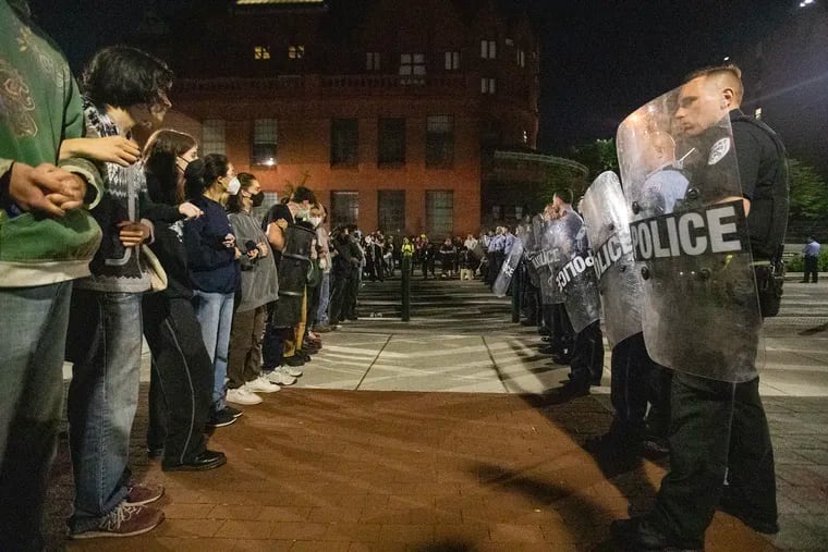 Pro-Palestinian protesters and Philadelphia and Penn police have a standoff along 34th Street at the University of Pennsylvania Friday night.