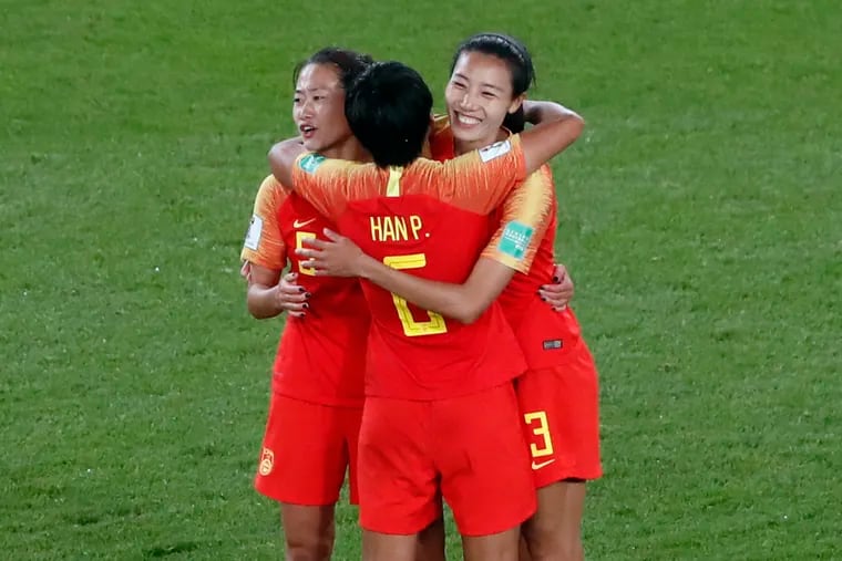 China's Wu Haiyan, China's Han Peng, and China's Lin Yuping, from left to right, celebrate their 1-0 win at the end of the Women's World Cup Group B soccer match between China and South Africa at the Parc des Princes in Paris, France, Thursday, June 13, 2019. (AP Photo/Thibault Camus)