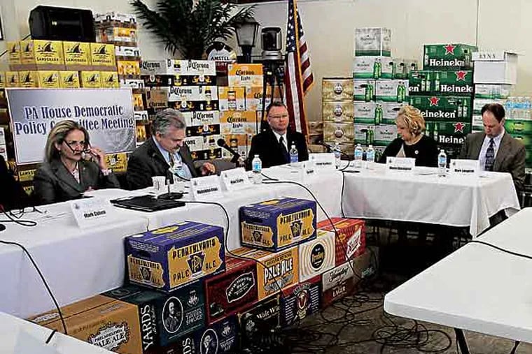 Nancy Dillett, right, who works at a PA. State Store, speaks during a House Democratic Policy Committee Hearing on the Privatization of State Liquor Stores at Big Top Beverage Market in Abington, Pa. on March 27, 2013.  ( DAVID MAIALETTI / Staff Photographer )