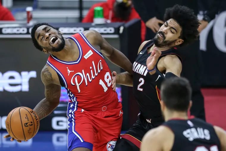 The Sixers' Shake Milton is fouled by the Heat's Gabe Vincent during the fourth quarter.