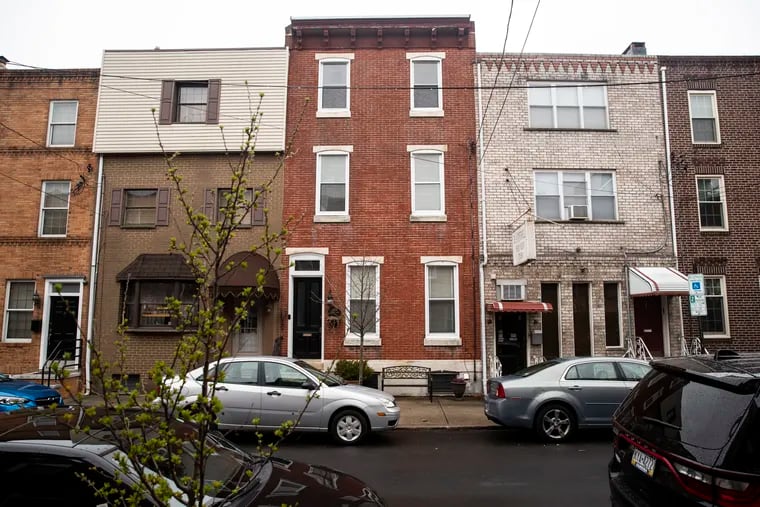 (center) The home Janet Anastasi turned into an Airbnb in Philadelphia.