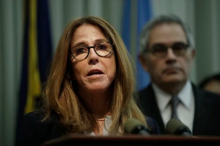 Marsha Levick, Chief Legal Officer for the Juvenile Law Center, accompanied by Philadelphia District Attorney Larry Krasner speaks with members of the media during a news conference in Philadelphia, Wednesday, Feb. 6, 2019. Krasner announced plans Wednesday to keep more juveniles out of the court system and keep many who are charged out of custody. (AP Photo/Matt Rourke)