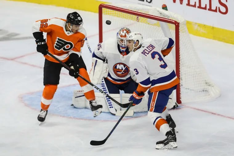 The Flyers' Connor Bunnaman looks for the loose puck in the team's preseason opener against the Islanders. Bunnaman is competing for an opening-night roster spot with the Flyers.