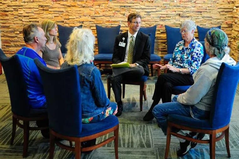 Patients join chaplain Drew Angus and Sister Anne McCoy at the Cancer Treatment Centers of America's hospital in Philadelphia.
