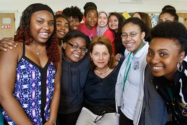 Award recipient Kathleen DiTanna is surrounded by some of her students at Philadelphia High School for Girls. TOM MIHALEK / For The Inquirer