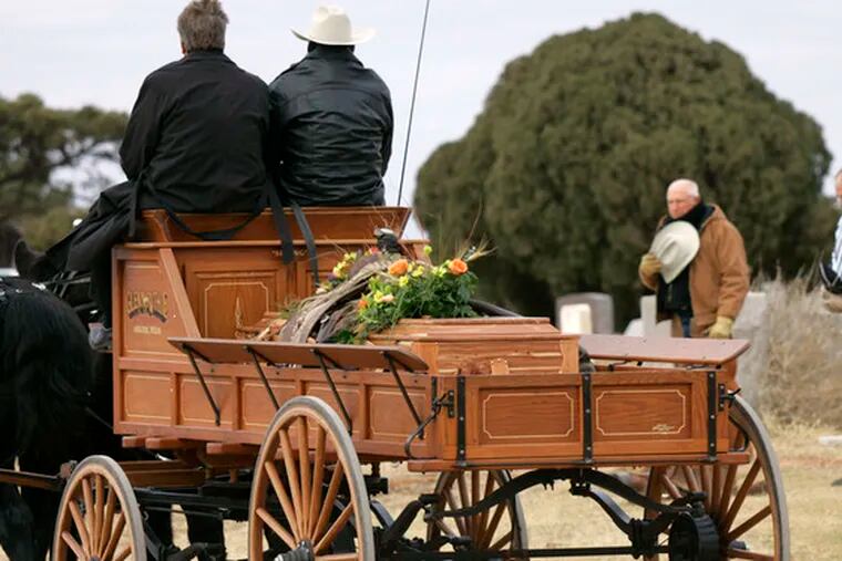 Horse-drawn wagon carries Sammy Baugh&#0039;s casket in Texas.