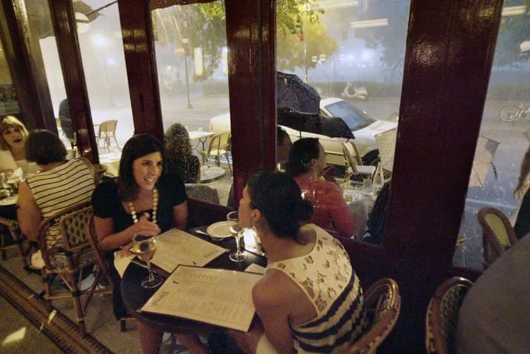 Dara Imperatore (left) and Traci Marabella (right, back to camera) dine inside Parc restuarant. Make sure to include Stephen Starr's cafe as part of your French weekend in Philly.
