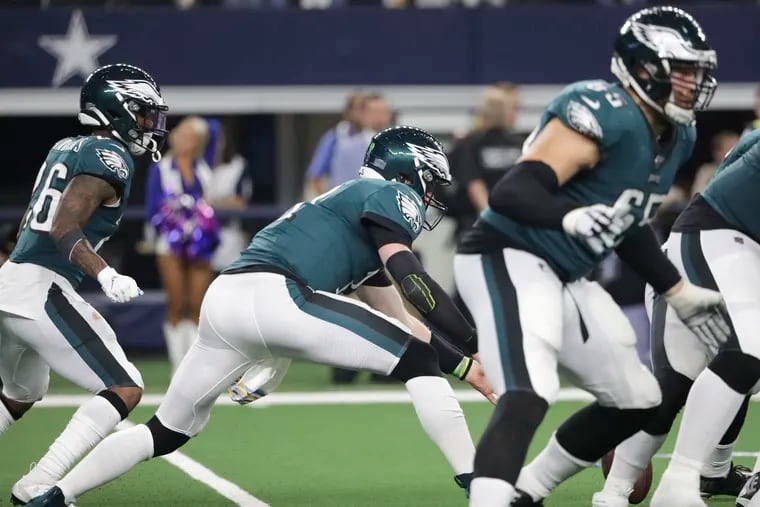 Eagles quarterback Carson Wentz goes after the fumbled football during the fourth-quarter on Sunday, October 20, 2019 in Arlington, TX.  The Cowboys recovered the football and scored.