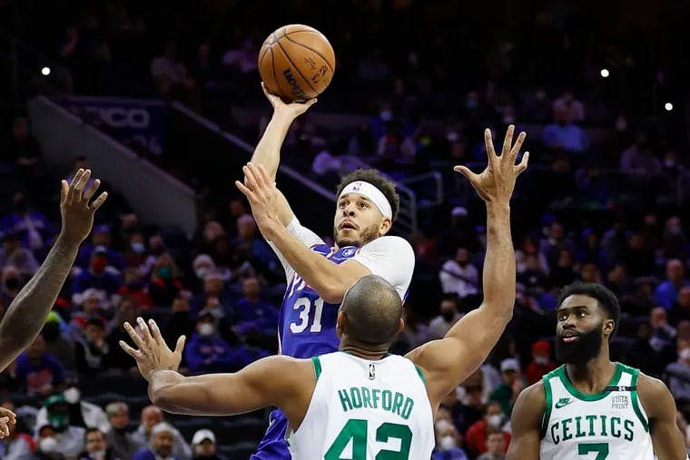 Sixers guard Seth Curry, shooting the basketball over Boston Celtics center Al Horford and guard Jaylen Brown earlier this month, was back in the starting lineup  on Saturday night.
