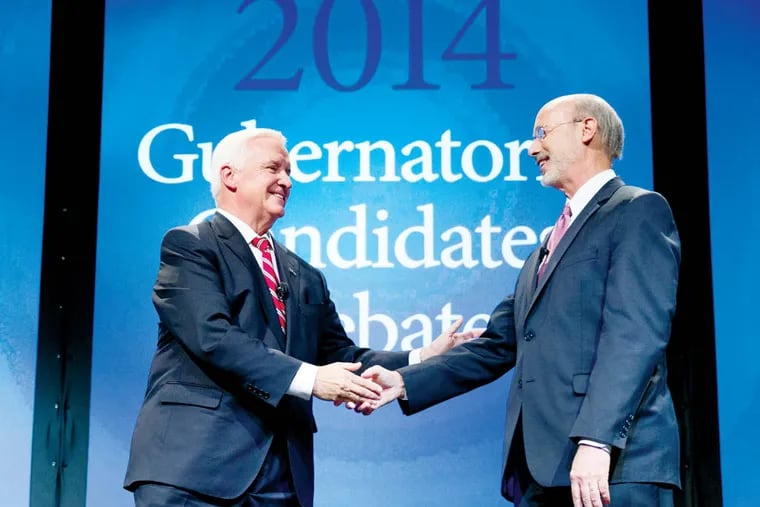Republican Gov. Tom Corbett, left, and Democrat Tom Wolf shake hands at the end of a gubernatorial debate hosted by the Pennsylvania Chamber of Business and Industry, Monday, Sept. 22, 2014, in Hershey, Pa. (AP Photo/Matt Rourke)