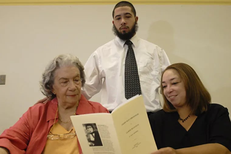 Elsie Styles-Harrison (left) William McNally, and Lisa Collins, all desendants of Paul Jennings look at the book he wrote. (Ron Tarver / Staff Photographer)