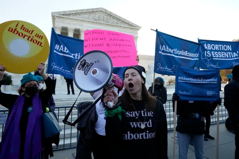 Pro-abortion rights protesters rally outside as the U.S. Supreme Court hears arguments in "Dobbs v. Jackson Women's Health Organization" in Washington, D.C. on Wednesday, Dec. 1, 2021.