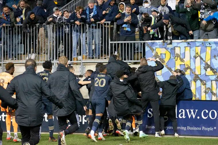 Jakob Glesnes was mobbed by teammates and manager Jim Curtin (right) after scoring the Union's game-winning goal against the Red Bulls in the 123rd minute on Saturday at Subaru Park.