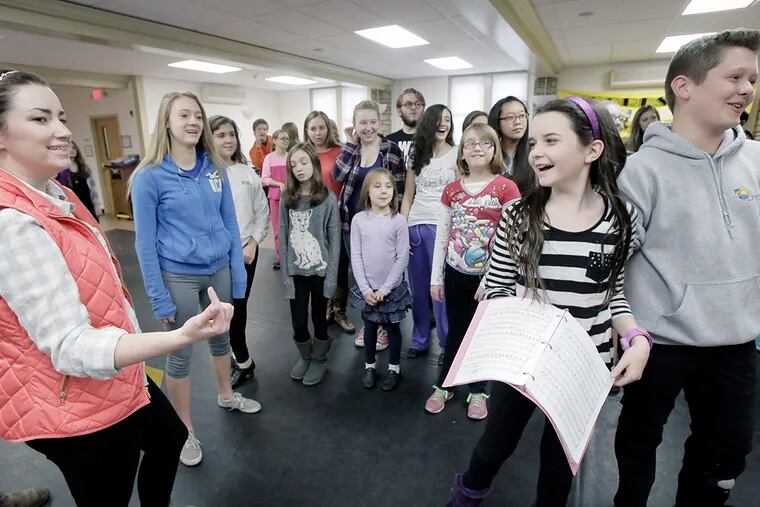 Choreography Director Kaitlin Tumulty (left), Juliet Morgan, 11, Ryan Coggan (far right) and the rest of the cast rehearse the scene "Stop Thief" during a Moorestown Theater Company rehearsal of  'Magic Tree House: A Ghost Tale for Mr. Dickens, Jr.'  ( ELIZABETH ROBERTSON / Staff Photographer )