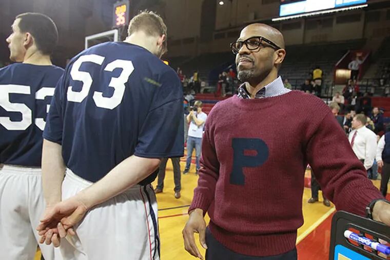 Penn head coach Jerome Allen stands with his players prior to their game against Princeton. (Charles Fox/Staff Photographer)