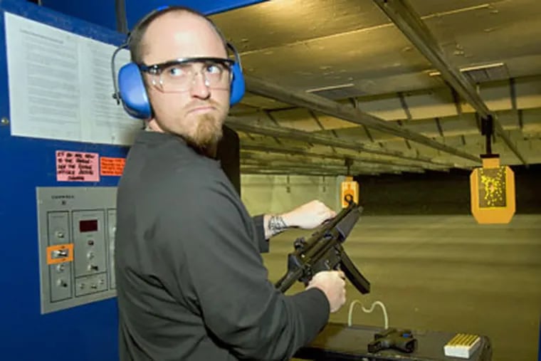 With the conclusion of Game 5 of the World Series on hold,  Brett Myers spent Tuesday firing bullets instead of fastballs with an MP5 fully automatic rifle at Targetmaster, a Chadds Ford firing range he frequents. (Ed Hille / Staff Photographer)