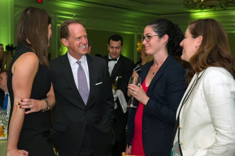 Sen. Patrick Toomey talks to Sandy Hook Promise supporters (from left) Susan Zook, Mara McDermott, and Nydia Bonnin at the event. (MARY F. CALVERT)