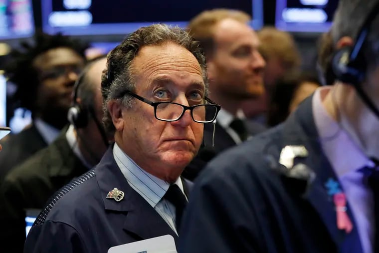 FILE - In this April 12, 2019, file photo trader Steven Kaplan works on the floor of the New York Stock Exchange. The U.S. stock market opens at 9:30 a.m. EDT on Monday, April 22. (AP Photo/Richard Drew, File)