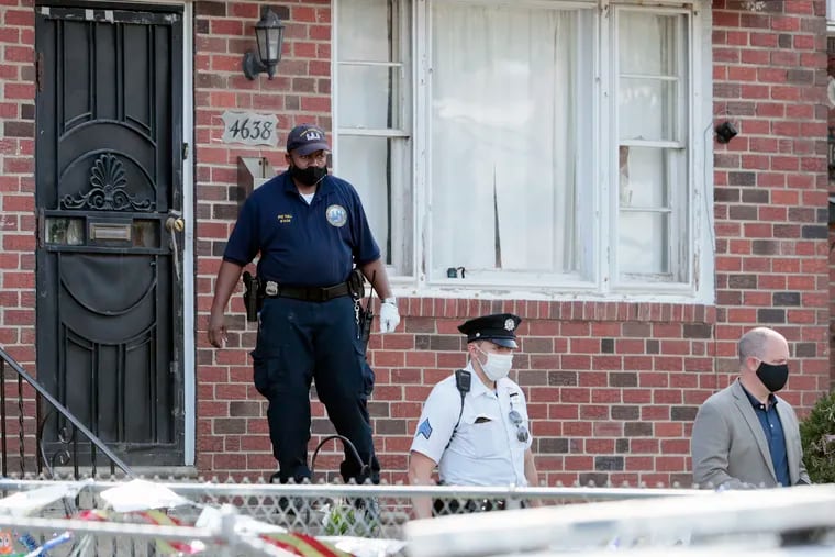 Phila. police leave a house in the Upper Holmesburg section of Northeast Philadelphia on Sunday where a six-year-old boy was fatally shot in the chest while in the home.