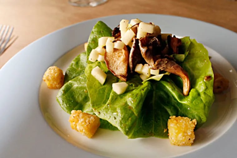 For a winter salad, hydroponically grown butterhead lettuce fills the bill, with cornmeal croutons tossed in apple cider vinaigrette. (Laurence Kesterson / Staff Photographer)