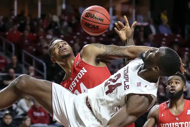 Temple's Ernest Aflakpui and Houston's Breaon Brady collide under the basket during the second half.
