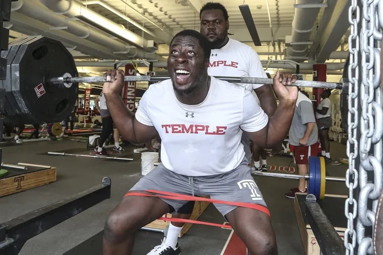 Michael Dogbe is a redshirt senior defensive tackle at Temple, he is 6-3, 280 and one of the strongest players in the history of the program. Dogbe squats 415lbs and is spotted by Freddie Booth-Lloyd. Monday, August 20, 2018. STEVEN M. FALK / Staff Photographer