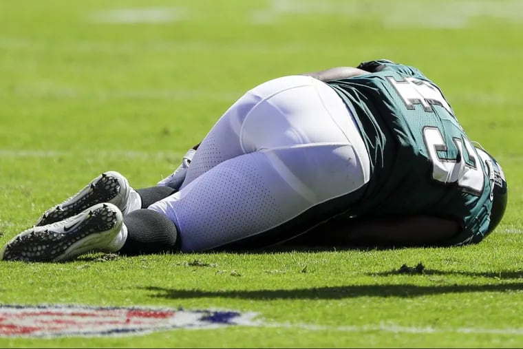 Eagles running back Darren Sproles lays on the turf after getting injured during the second-quarter against the New York Giants on Sunday, September 24, 2017 in Philadelphia. YONG KIM / Staff Photographer